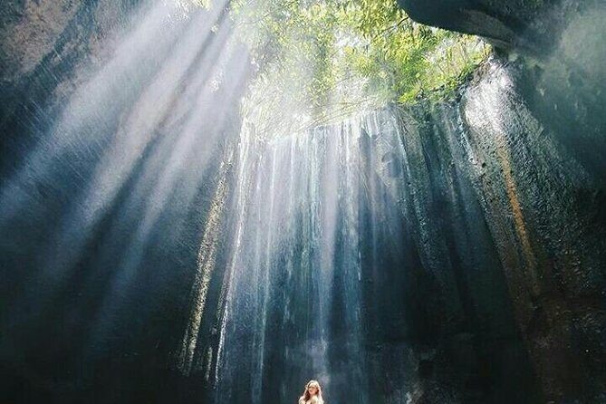 Bali best waterfall - Tukad Cepung Waterfall: a cliff-framed stop with “light through water” vibes