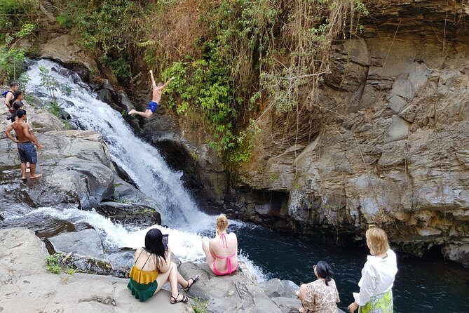 Cliff Jumping and Sliding at Aling Aling Waterfall - Safety reality: water flow, slippery stairs, and a strong guide