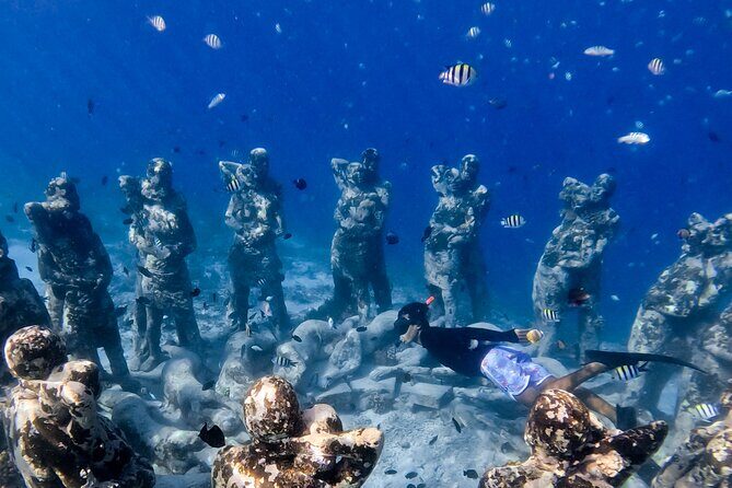 Snorkeling with turtle and statue in Gilis - Why This Trip Works Better Than Snorkeling From Shore